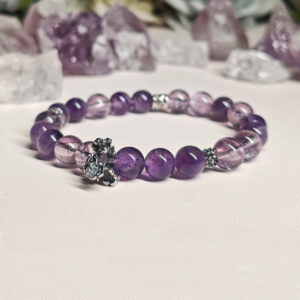 Display view of amethyst bracelet showing natural purple tones