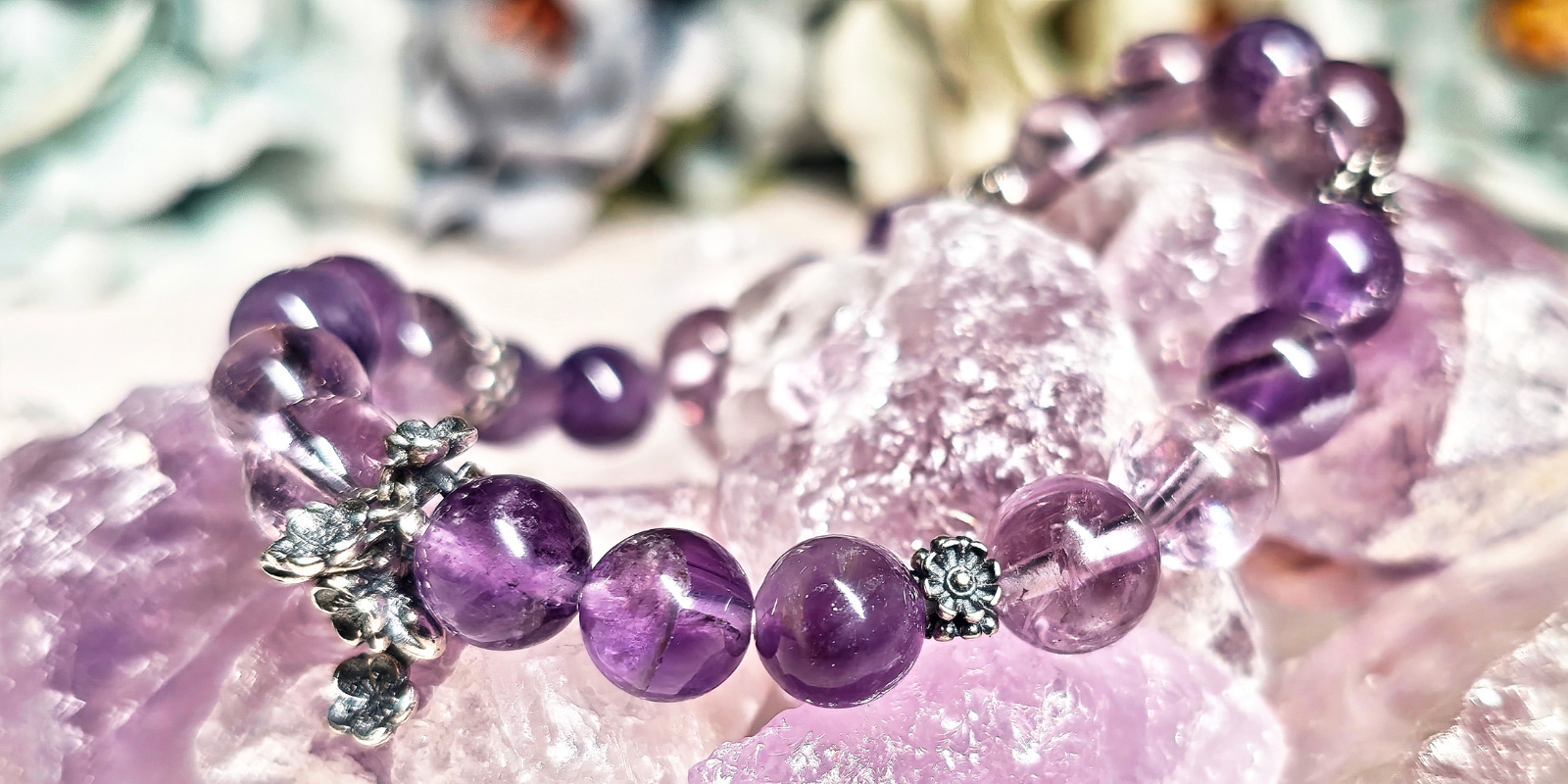 Lifestyle display of amethyst bracelet in a soft natural setting