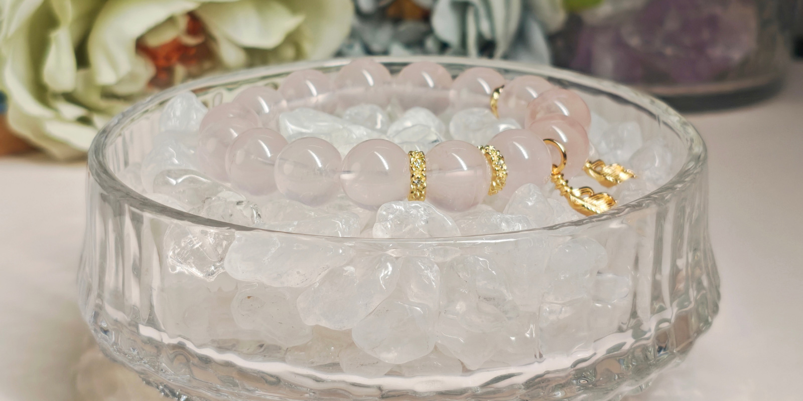 Lifestyle display of rose quartz bracelet highlighting its soft pink beauty