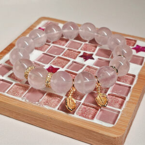 Product view of rose quartz bracelet arranged for display
