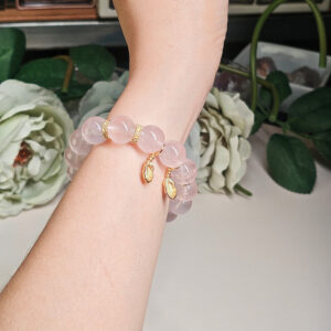 Rose quartz bracelet worn on wrist showing natural pink crystal shine