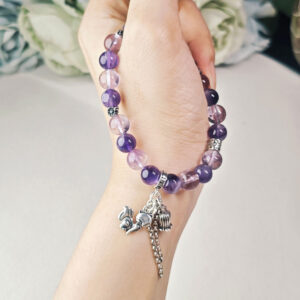 Woman wearing amethyst bracelet during work for focus and stress relief