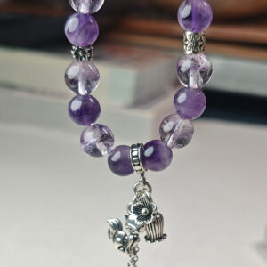 Amethyst crystal bracelet placed in a calm setting for stress relief and relaxation