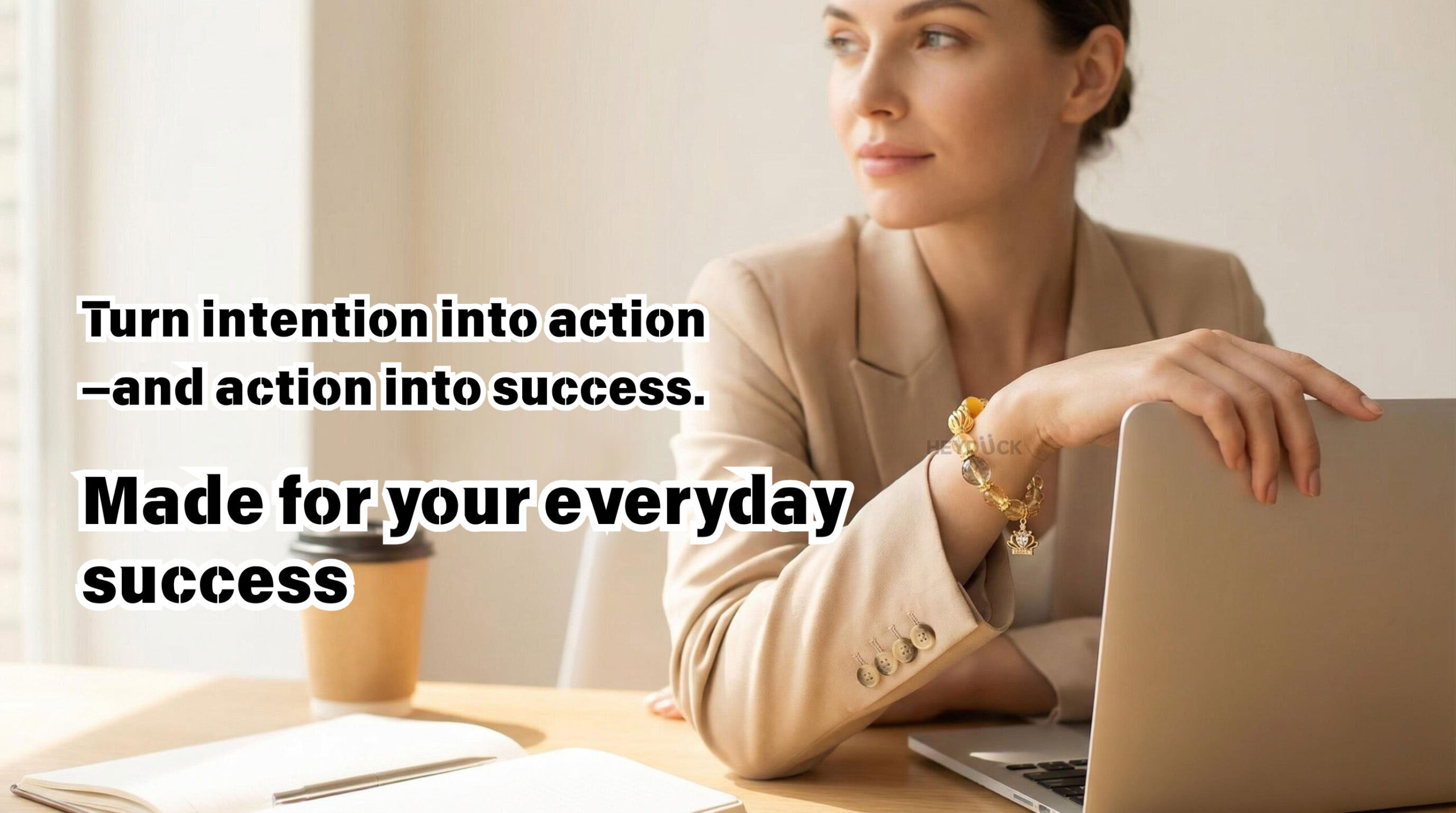 Golden rutilated quartz and citrine bracelet worn in a daily work setting representing success, confidence, and modern lifestyle