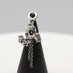 Violet Hour Bracelet Fox Charm Detail Close-up of a Thai silver fox charm with a flower bead cap and chain tassel on the Violet Hour crystal bracelet.