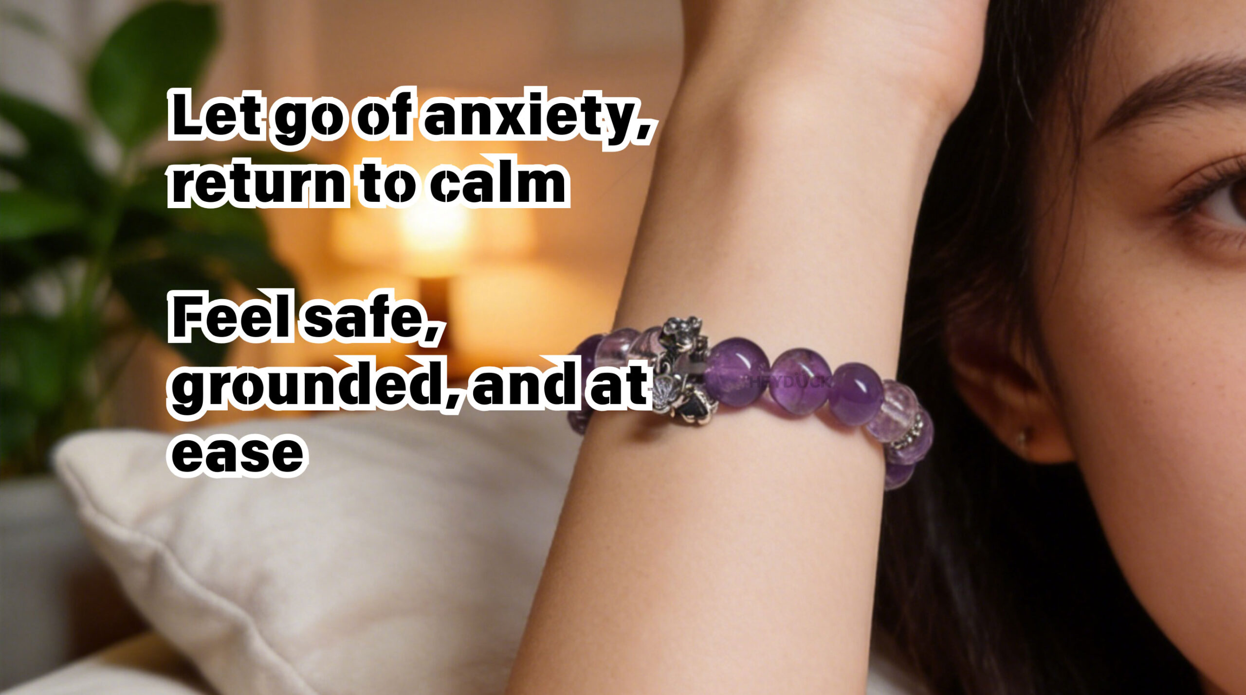 Woman wearing amethyst bracelet in a peaceful moment for anxiety relief and emotional balance