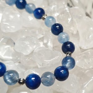 Close-up details of natural blue kyanite crystal bracelet beads with calming blue tones