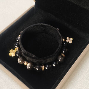 Product display of DualFortune CL silver obsidian bracelet