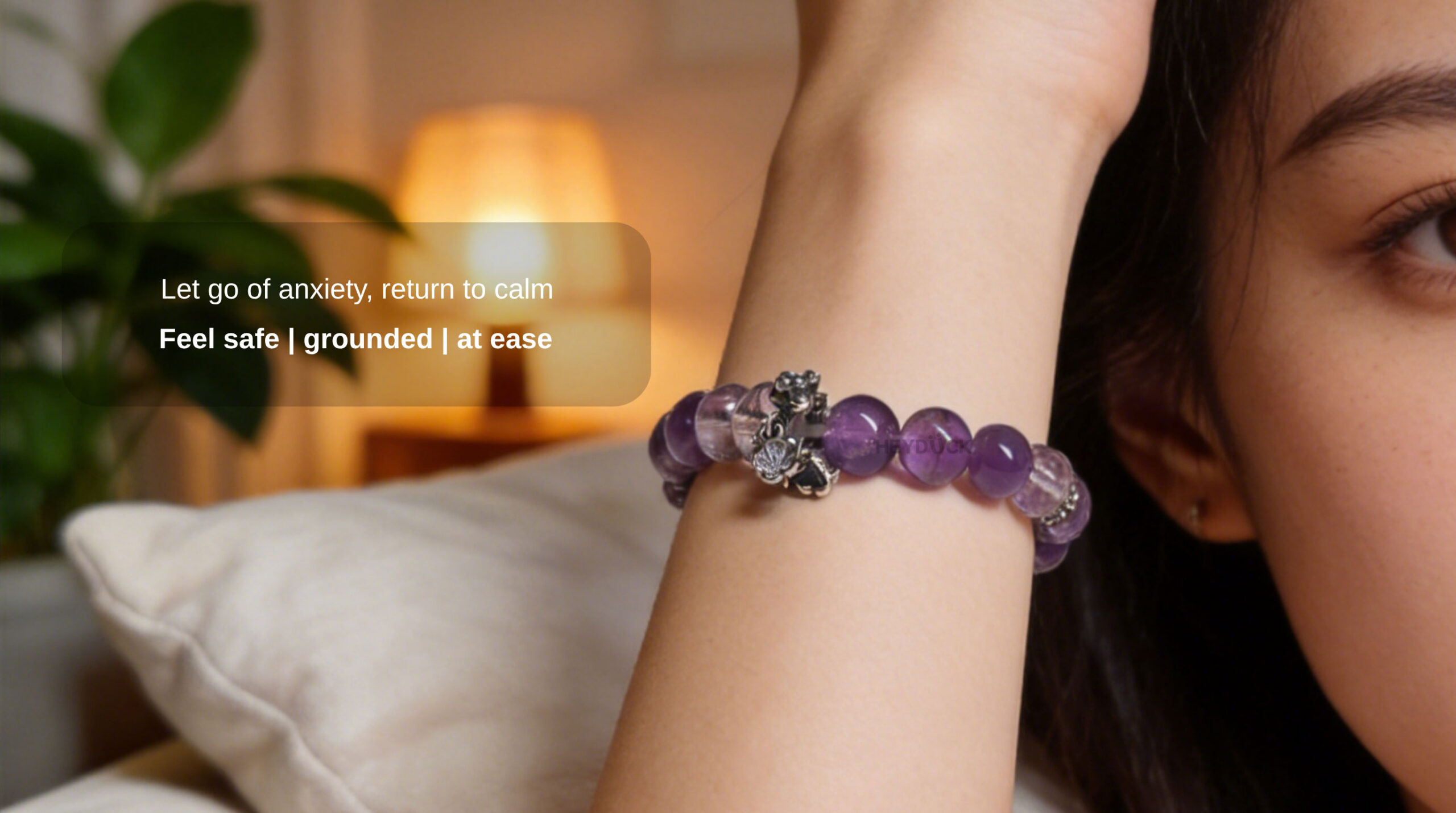 Woman wearing a natural amethyst bracelet to feel calm, grounded, emotionally balanced, and at ease.