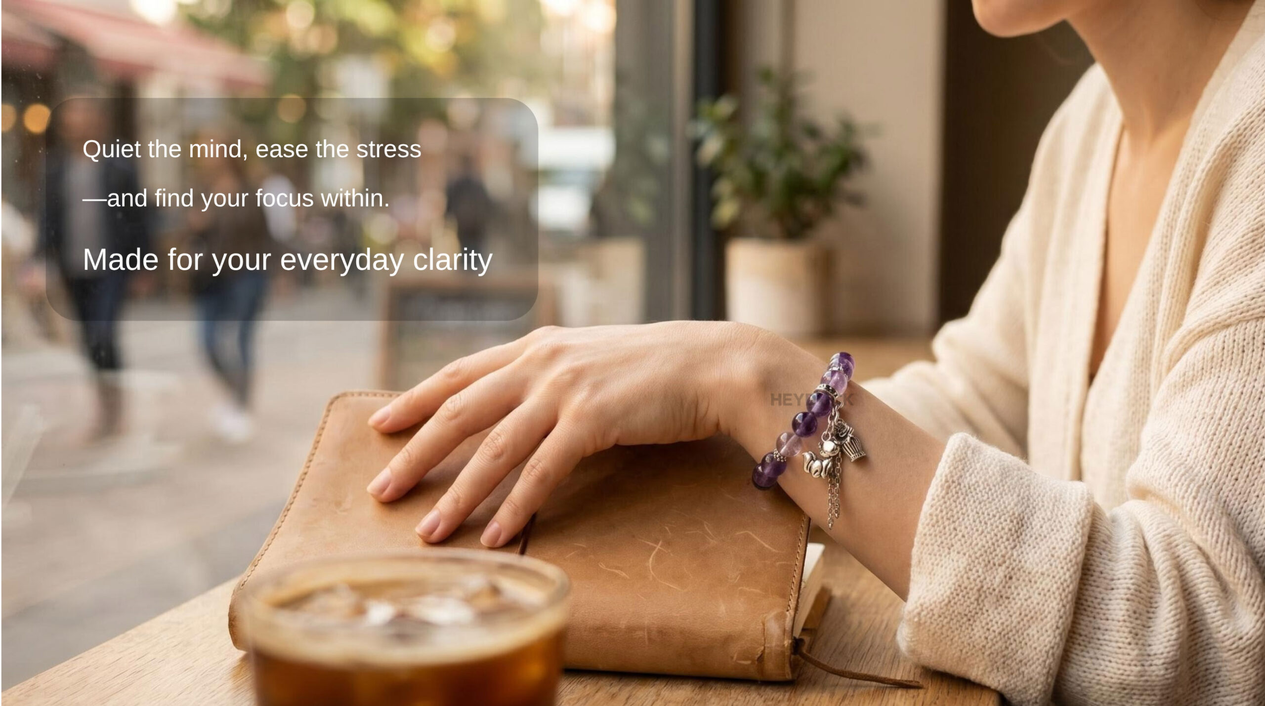 Woman wearing a natural amethyst bracelet for stress relief, calm focus, and everyday clarity.