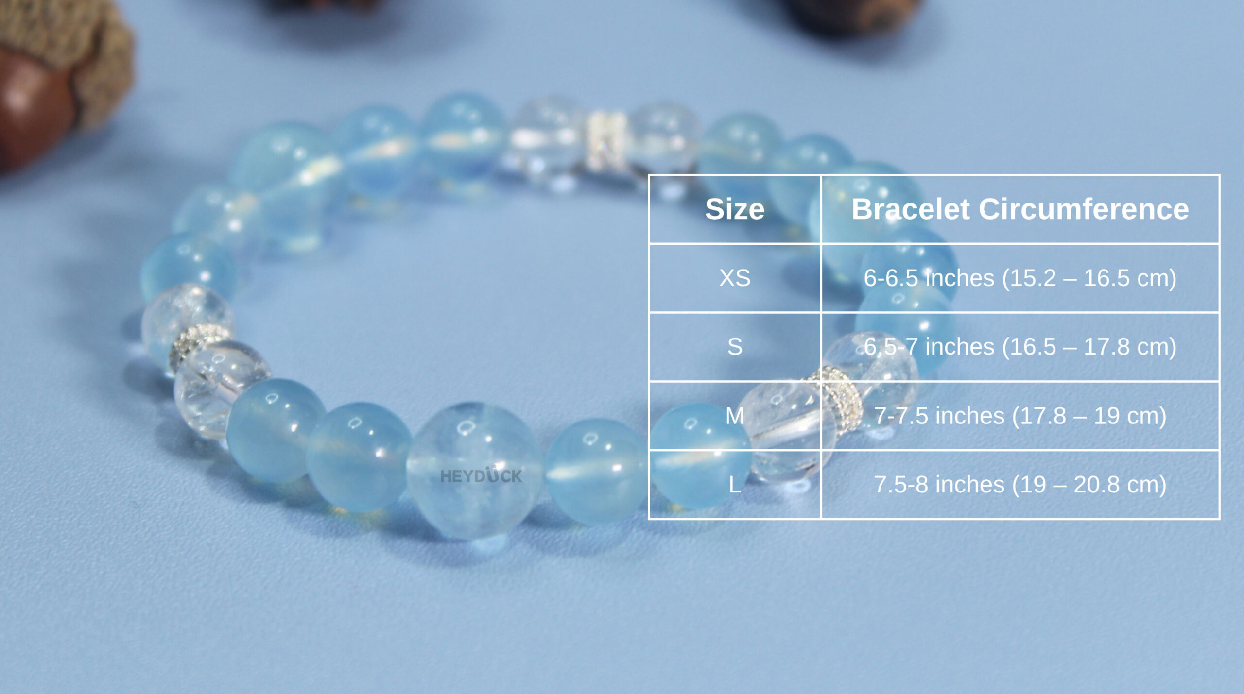 Size guide showing bead dimensions and wrist measurement instructions for the handmade natural aquamarine bracelet.