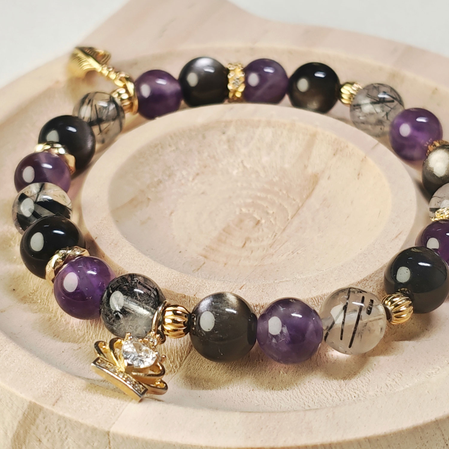 Handcrafted crown feather guardian bracelet with Amethyst, Silver Obsidian, and Black Rutilated Quartz