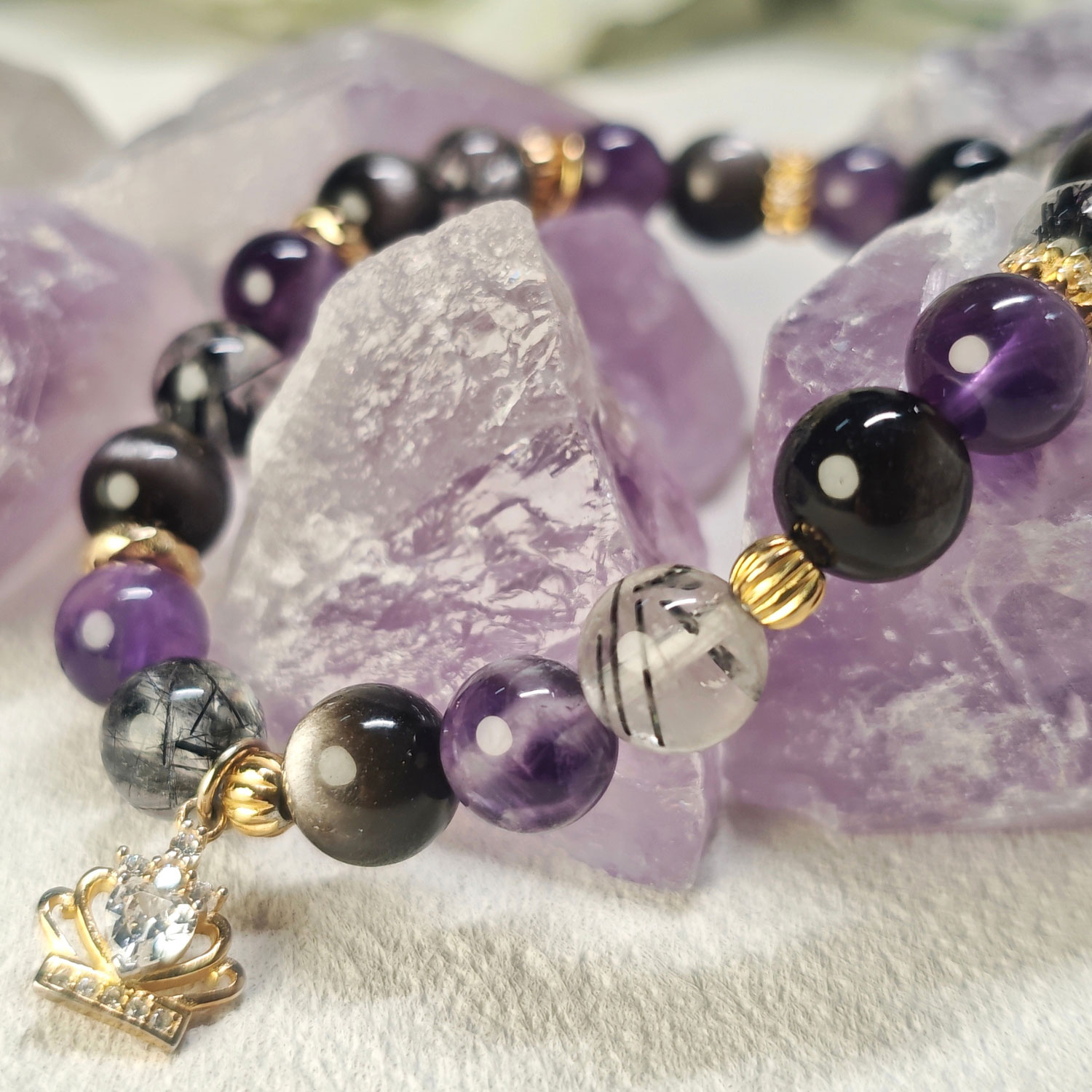 Amethyst, Silver Obsidian, and Black Rutilated Quartz used in crown feather guardian bracelet