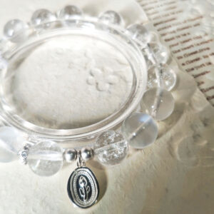 Detailed view of the 925 sterling silver tulip charm and spacer beads on the Moonstone Tulip Promise Bracelet