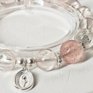 Close-up of the 925 sterling silver tulip charm, spacer beads, and natural crystal bracelet craftsmanship
