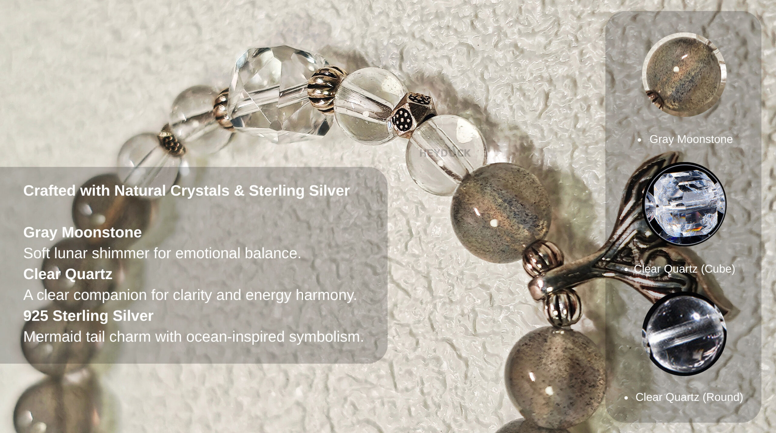 Natural gray moonstone, clear quartz beads, and 925 sterling silver mermaid tail charm used in the Gray Moonstone Tide Bracelet