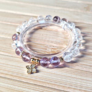Ice Lavender Quartz Clarity Bracelet featuring Ice Clear Quartz beads and a gold-plated four-leaf clover charm