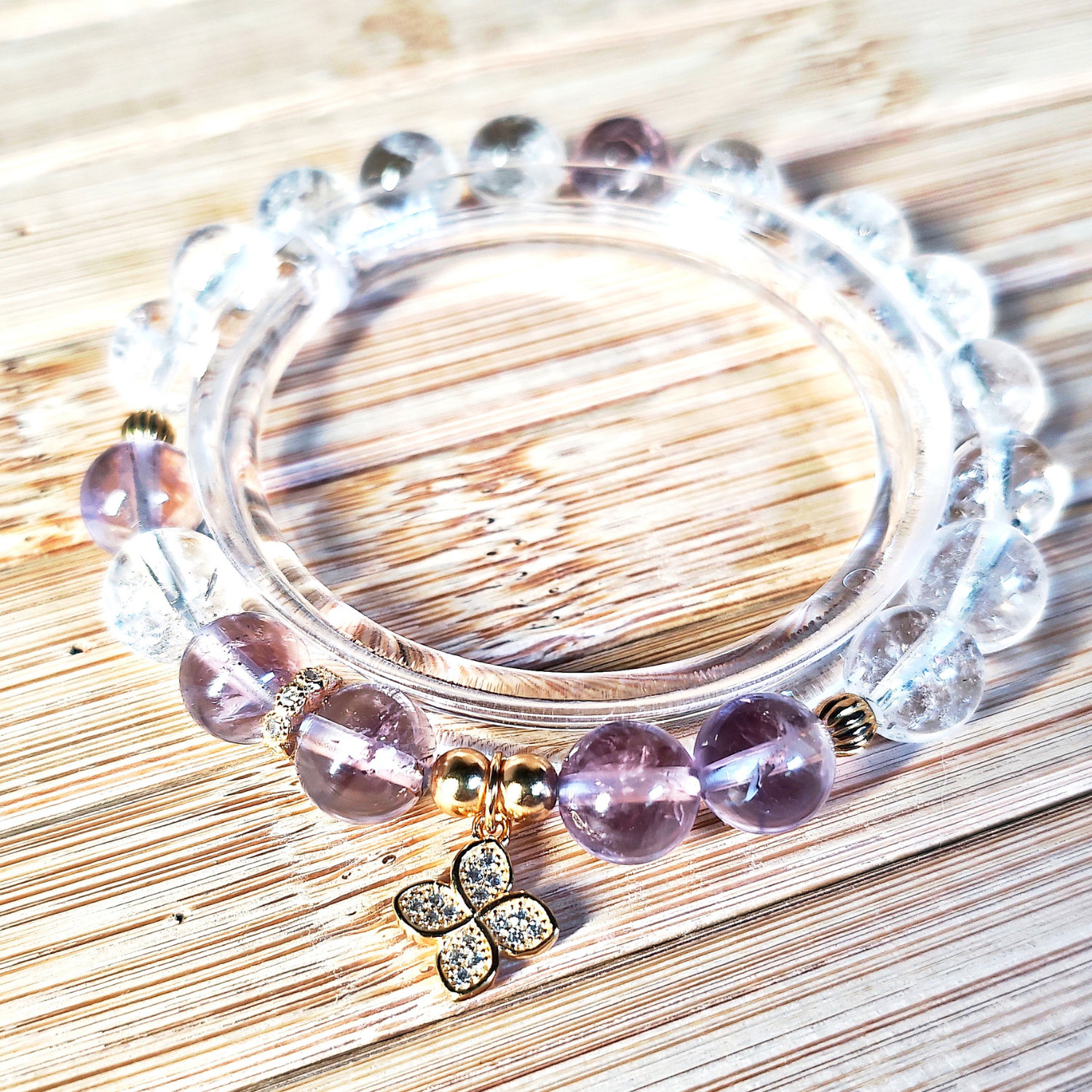 Ice Lavender Quartz and Clear Quartz bracelet with four-leaf clover charm symbolizing clarity and luck