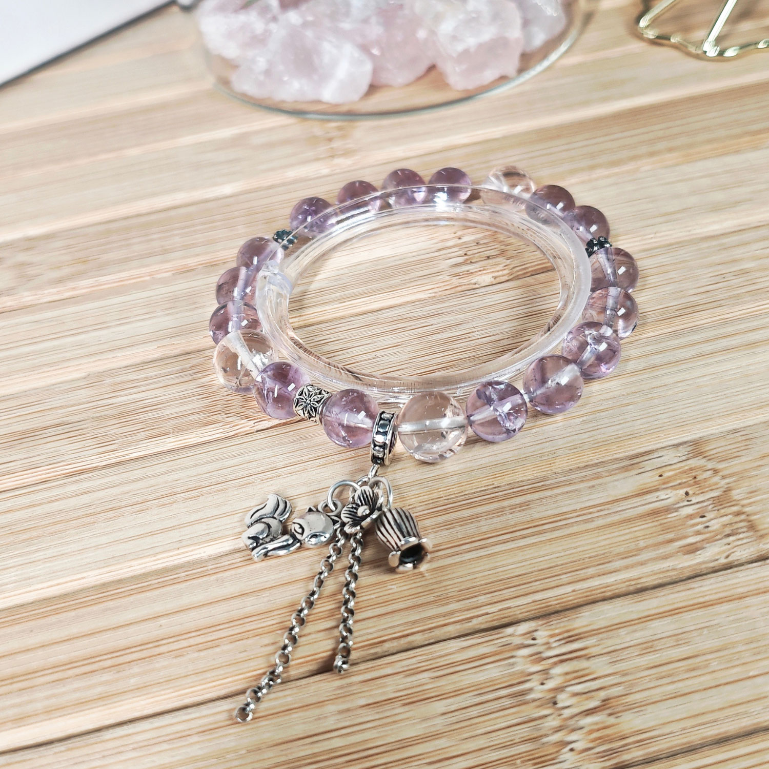 Close-up of an Ice Lavender Quartz Fox Bracelet featuring translucent Ice Lavender Quartz, Ice Rose Quartz, and a vintage 925 sterling silver fox pendant.
