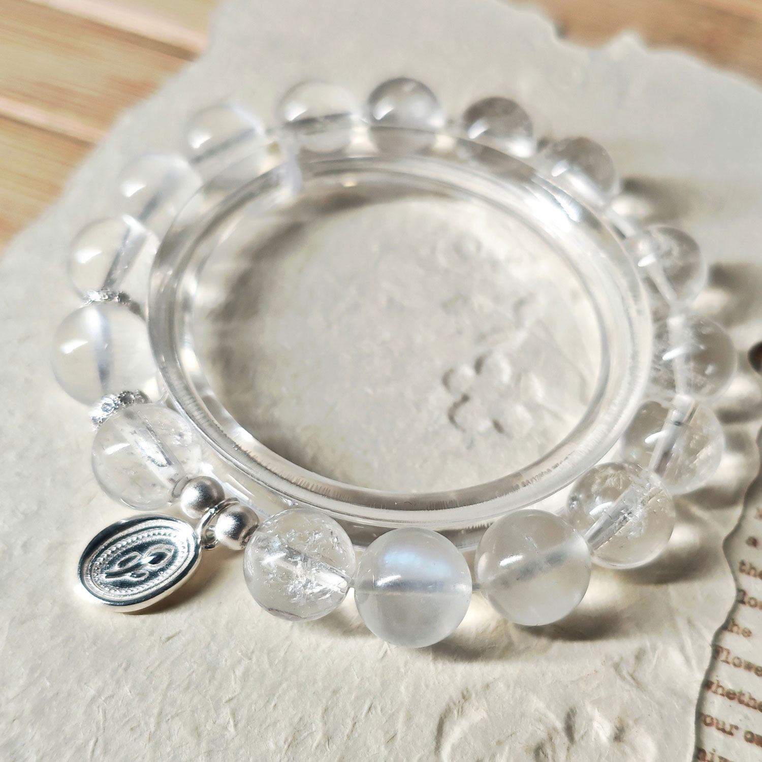 Close-up view of Moonstone and Ice Clear Quartz beads showing the natural crystal beauty of the HeartGuard bracelet
