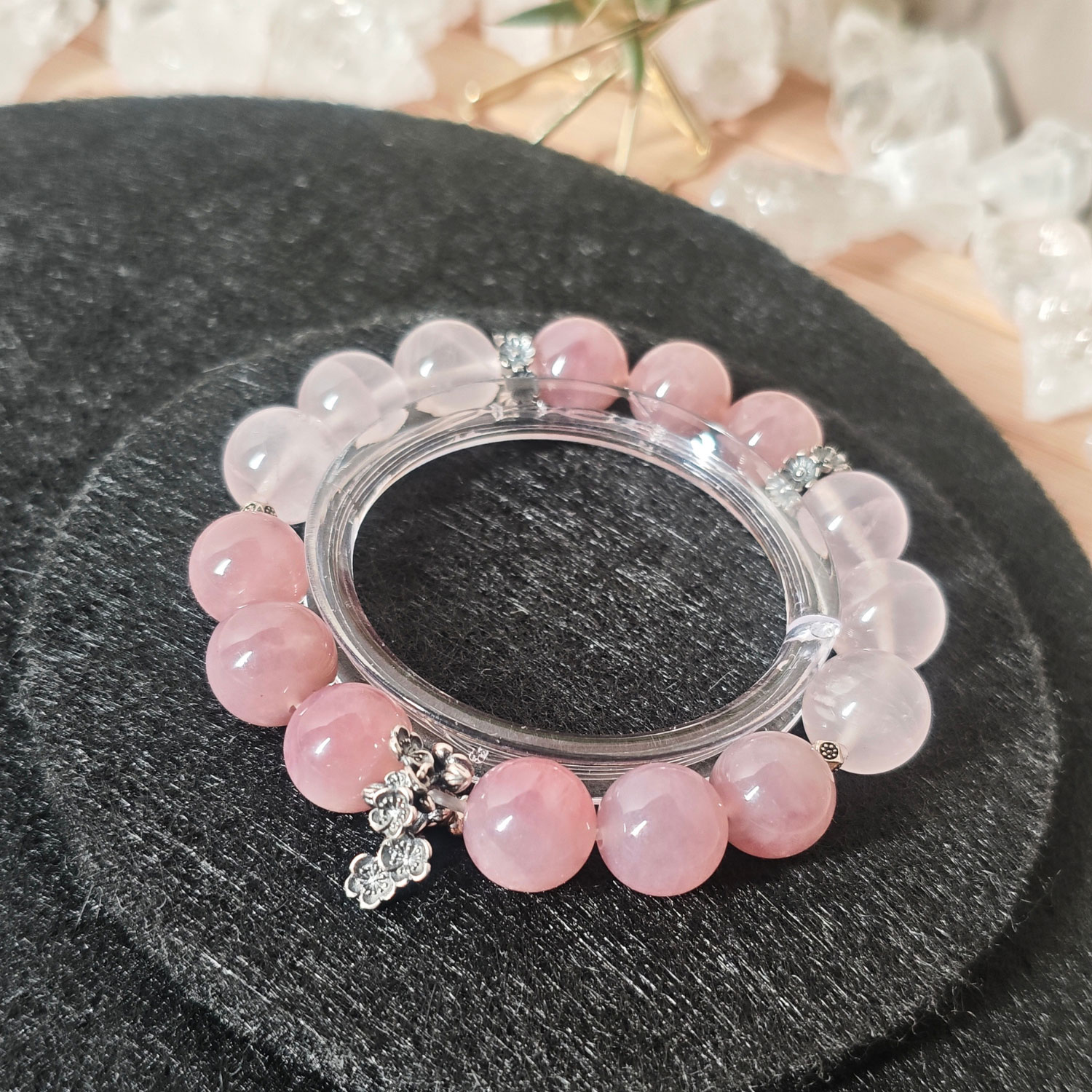 Close-up of premium Mozambique Rose Quartz, Star Madagascar Rose Quartz, and handcrafted 925 sterling silver sakura accents.
