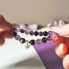 Amethyst Silver Obsidian Bracelet symbolizing inner calm, gentle protection, and quiet growth with a delicate flower charm.