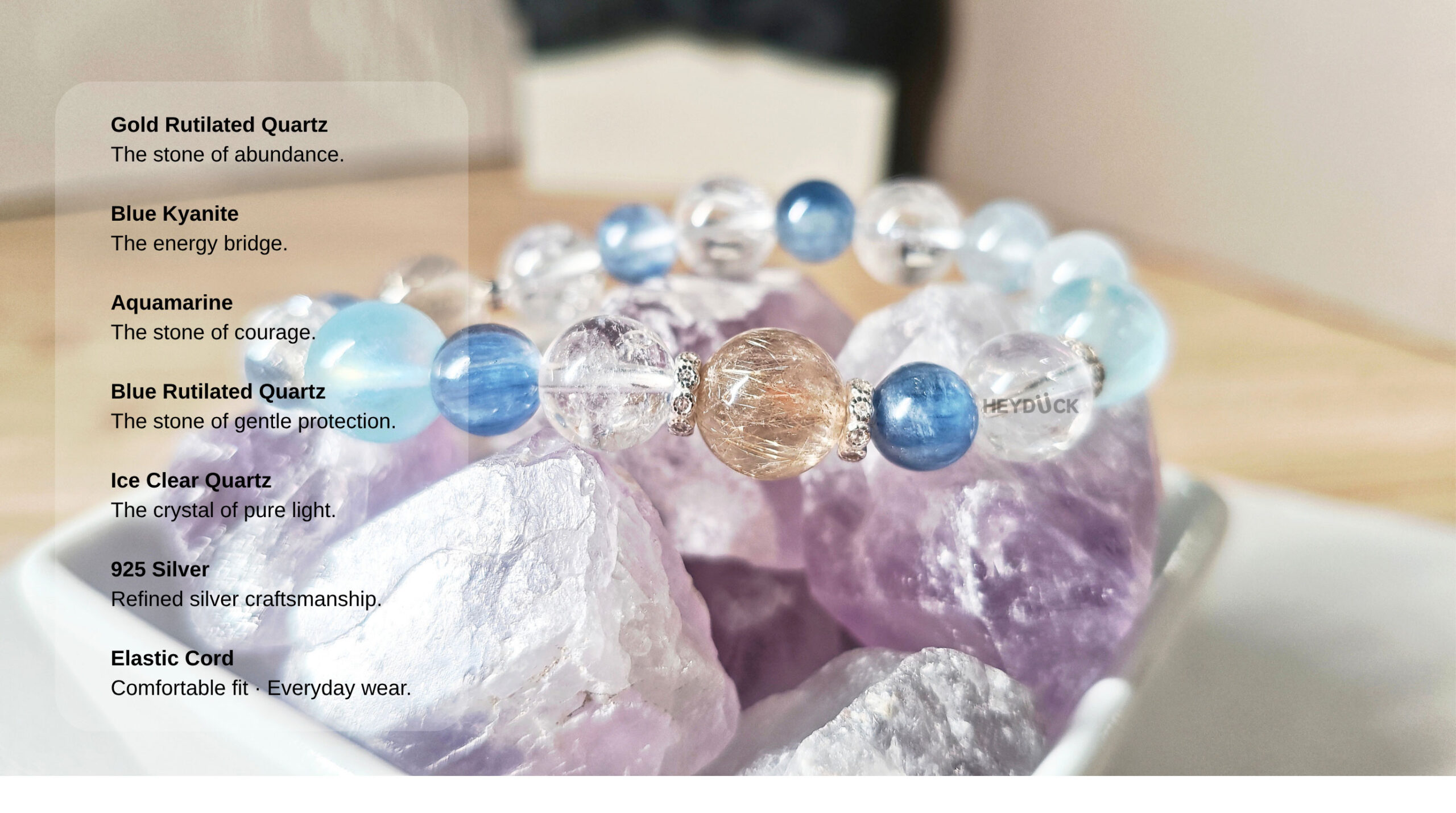 AuroraGain CL bracelet materials including gold rutilated quartz, blue kyanite, aquamarine, blue rutilated quartz, ice clear quartz, 925 silver, and elastic cord