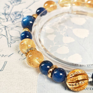 Close-up detail of Ice Citrine and Blue Kyanite beads with polished 925 sterling silver gold-plated spacer beads on the GiltWealth CL bracelet.