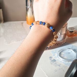 Woman wearing the Ice Citrine Blue Kyanite Bracelet, showing its elegant fit and refined crystal jewelry style for everyday wear.