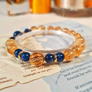 Elegant view of the Ice Citrine Blue Kyanite Bracelet with warm golden citrine tones, deep blue kyanite beads, and refined gold-plated details.
