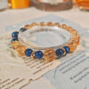 Ice Citrine Golden Horizon Bracelet from GiltWealth CL featuring natural ice citrine beads, blue kyanite accents, and gold-plated spacer beads.