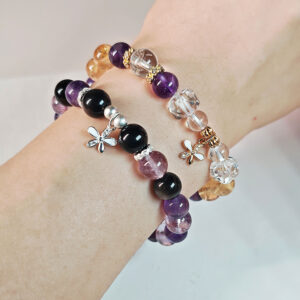 Midnight Bloom Amethyst & Silver Obsidian Bracelet worn on the wrist, a meaningful crystal jewelry piece for women seeking calm and balance.