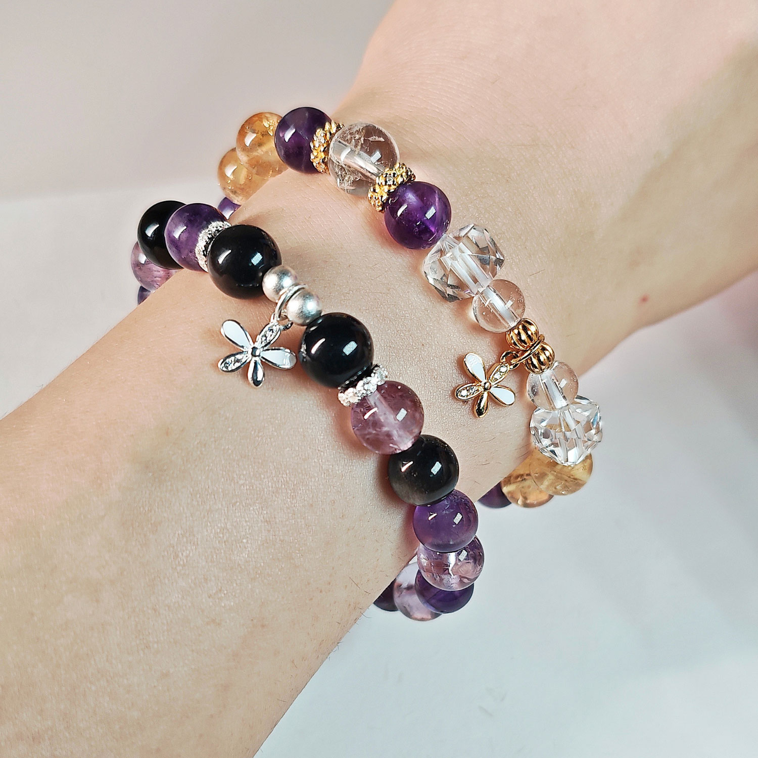 Midnight Bloom Amethyst & Silver Obsidian Bracelet worn on the wrist, a meaningful crystal jewelry piece for women seeking calm and balance.