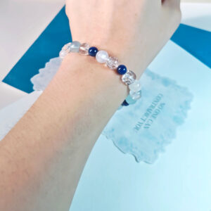 Ocean Serenity Crystal Bracelet worn on a woman's wrist, creating an elegant everyday look with calming blue crystal tones.