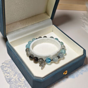 SkyFlow CL crystal bracelet featuring a Thai silver feather charm and elegant natural crystal details