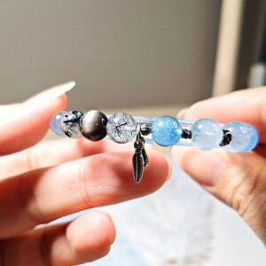 Natural crystal bead details of SkyFlow CL bracelet with aquamarine, clear quartz, moonstone, and obsidian accents