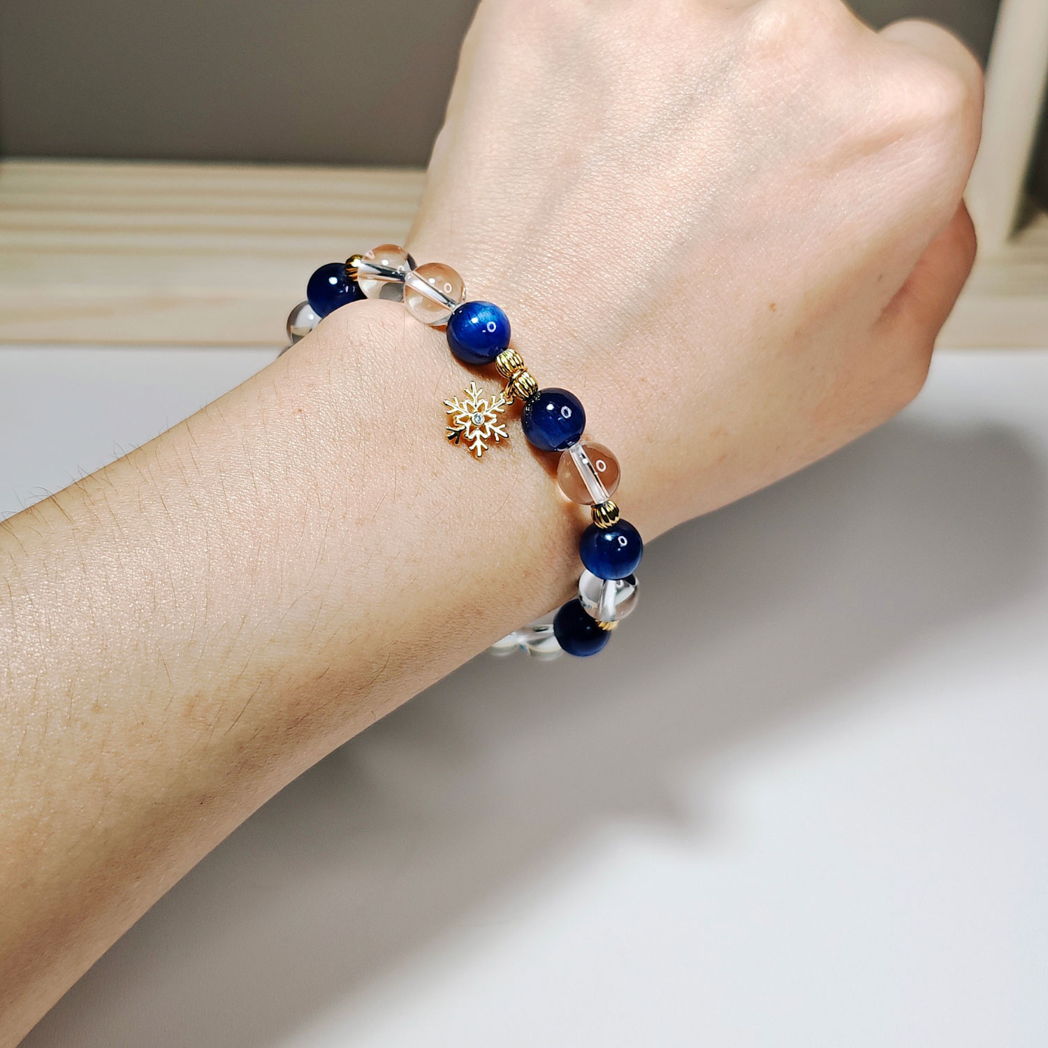SnowPoise CL crystal bracelet worn on a woman's wrist, designed for calm presence, clear expression, and graceful everyday wear