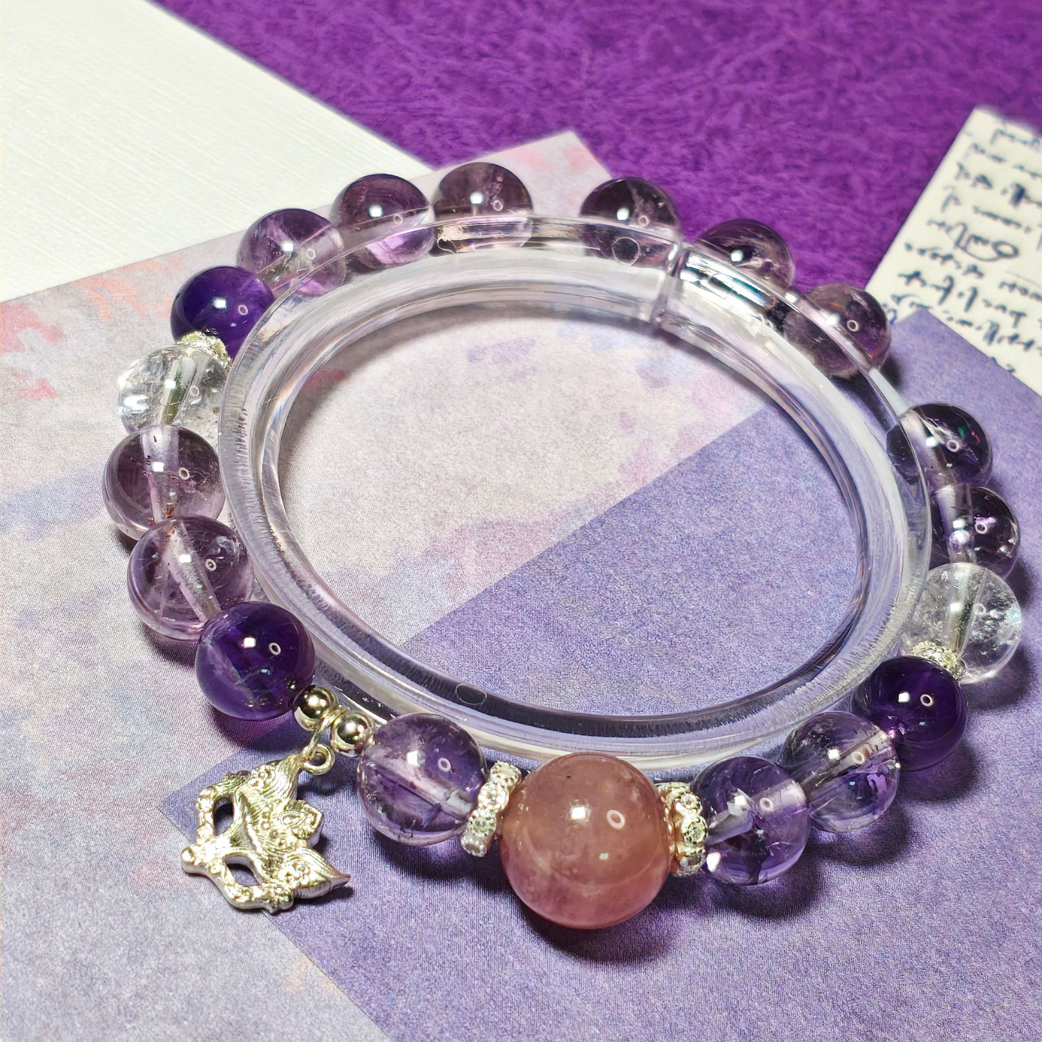 Crystal bracelet for intuition and wisdom featuring rose quartz, amethyst, clear quartz, and lavender quartz