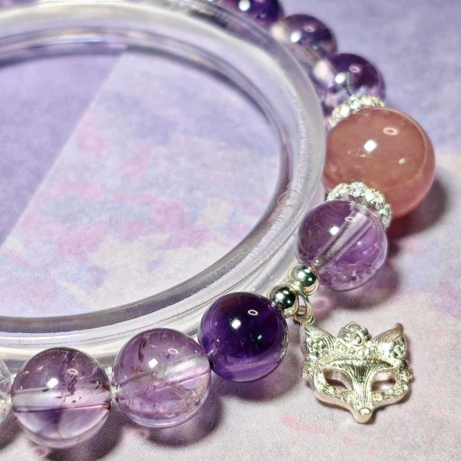 Detailed view of the 925 sterling silver fox charm and natural crystal beads on WiseBloom CL