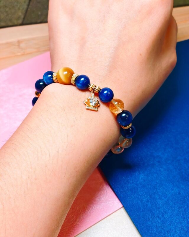 Bracelet worn on the wrist, blue kyanite and pale citrine visible across the top