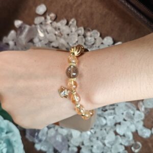 Wearing image showing golden rutilated quartz and citrine bracelet on wrist