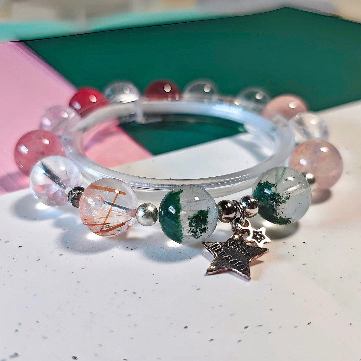 Rooted Glow crystal bracelet shown full circle, with its sterling silver star charm at the front.